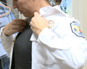 Photo 5 - female officer using vest under her uniform